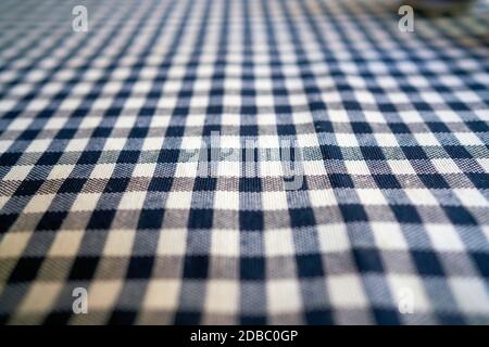 Checked tablecloth on a table in a restaurant Stock Photo