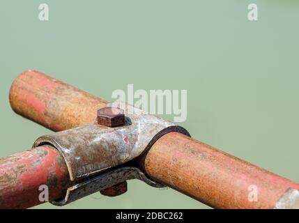 Scaffolding pipe clamp and parts, An important part of building strength to scaffold clamps in used close up on construction site,platforms for stage Stock Photo