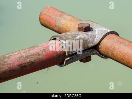 Scaffolding pipe clamp and parts, An important part of building strength to scaffold clamps in used close up on construction site,platforms for stage Stock Photo