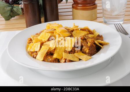 A bowl of taco salad with ground beef, rice and corn chips Stock Photo