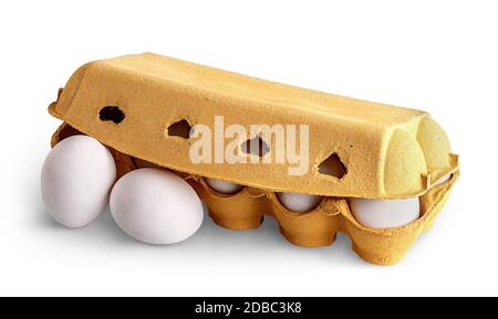 Closed cardboard egg tray and two eggs in front isolated on white background Stock Photo