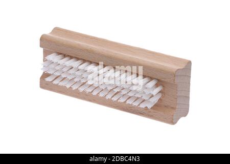 A traditional wood nail brush with short bristles inclined on a white background Stock Photo