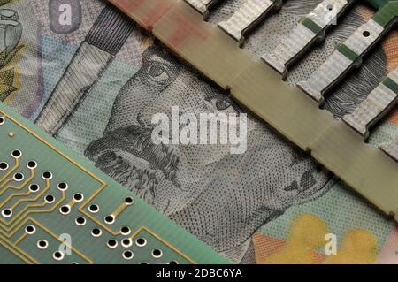 Closeup on Romanian banknote with circuit board Stock Photo