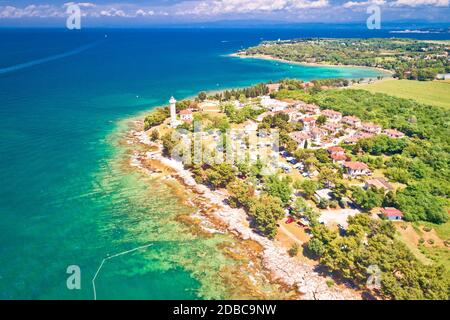 Savudrija lighthouse and turquoise crystal clear rocky beach aerial view, westernmost point of Croatia Stock Photo