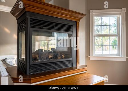 Elegant cast iron modern fireplace in master bedroom suite bathroom Stock Photo