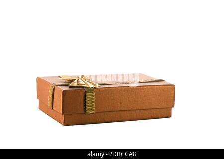 closed rectangular golden gift box for jewelry isolated on white background. Wedding, romantic concept. Jewelry. Stock Photo