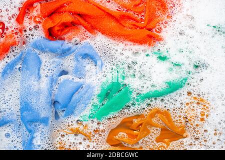 Color clothes soak before washing. Top view Stock Photo - Alamy