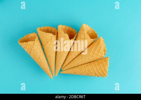 Wafer cups for ice cream on a turquoise background Stock Photo