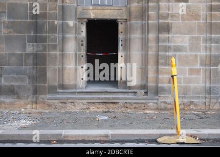 Dresden, Germany. 25th Nov, 2019. A barrier tape hangs from an entrance to the catacombs under Augustus Bridge. A fire in the catacombs had cut off the power supply to the State Art Collections in the early morning. Dresden's Green Vault treasure chamber was broken into early in the morning. Just under a year after the art theft in Dresden's Green Vault, police arrested three suspects in Berlin on November 17, 2020. Credit: Sebastian Kahnert/dpa-Zentralbild/dpa/Alamy Live News Stock Photo
