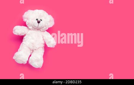 Toy white bear on pink background. Copy space Stock Photo