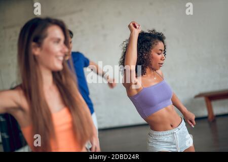 Women having a modern dance class in a group Stock Photo