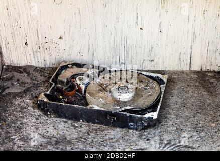 Broken Hard Disk Drive in the Old and Dirty Furniture Stock Photo