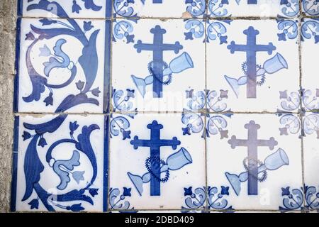 Tiles with geometric and religious motifs. Decoration with the typical Portuguese tiles (white and blue) inside a church in Portugal Stock Photo