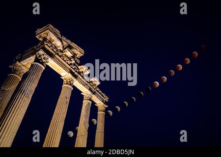 Total Lunar Eclipse over the Apollo Temple in Side, Turkey Stock Photo