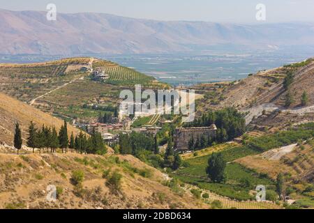 Panorama of the Bekaa Valley landscape with the Niha Roman temple, vineyard hills and mountains, in Zahle, Lebanon Stock Photo