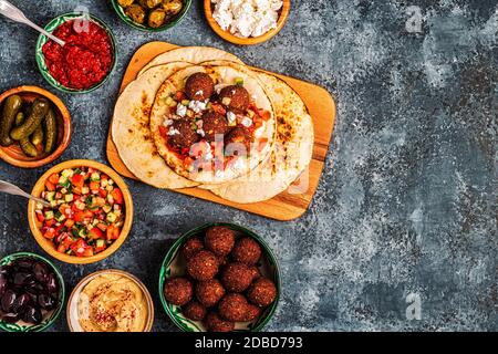 Falafel - traditional dish of Israeli and Middle Eastern cuisine, top view. Stock Photo