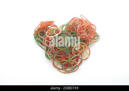 Colorful rubber bands for making rainbow loom bracelets in heart shape isolated on white background Stock Photo
