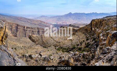 Panoramic view of Wadi Ghul aka Grand Canyon of Arabia in Jebel Shams, Oman Stock Photo