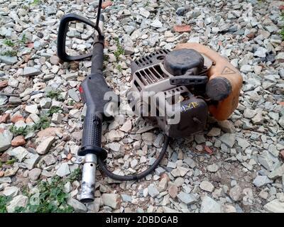 Parts from broken motos. Petrol trimmer disassembled. Stock Photo