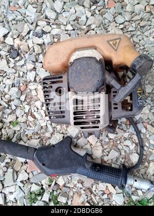 Parts from broken motos. Petrol trimmer disassembled. Stock Photo