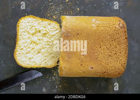 Fresh fragrant bread against a dark background. Assortment of baked bread on dark table background. Fresh fragrant bread on the table. Top views, clos Stock Photo