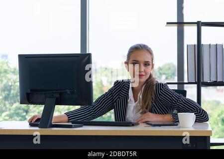 Free Photo | Businessman cheerful employee standing at yoga pose at office  on working table meditating after work