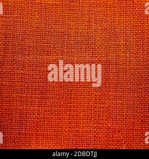 Rustic canvas fabric texture in orange  magenta color. Stock Photo