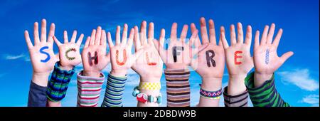 Children Hands Building Colorful German Word Schulfrei Means School Holidays. Blue Sky As Background Stock Photo
