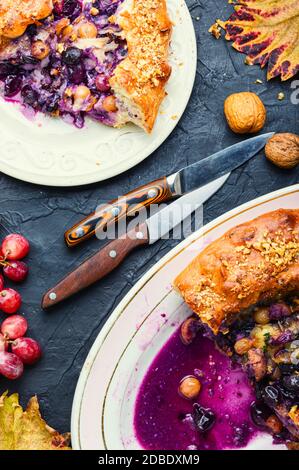 Florentine schiacchata with autumn grapes.Italian dessert.Sliced grape pie. Stock Photo