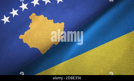 Kosovo and Ukraine two flags textile cloth, fabric texture Stock Photo