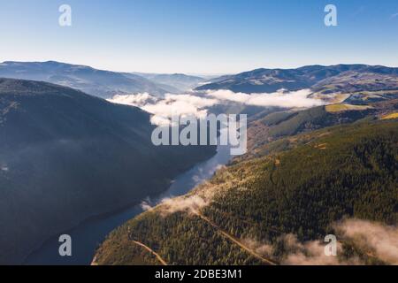 Landscape a river with fog and mountains in a clear day Stock Photo