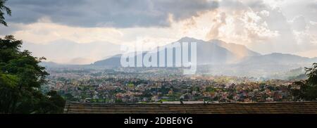 Panorama of Kathmandu valley, with cloudy sky and sunset, town and hills, from Shivapuri Nagsrjun National Park in Nepal. Stock Photo