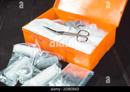 Open compulsory car first aid kit with kind fisrt aid equipment, healthcare concept Stock Photo