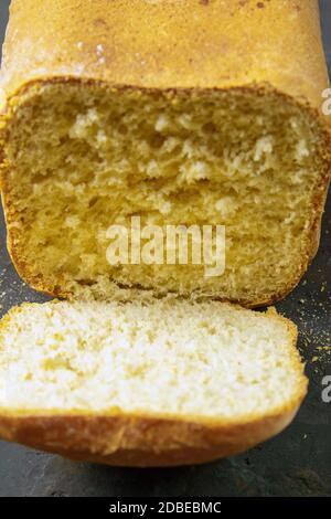Fresh fragrant bread against a dark background. Assortment of baked bread on dark table background. Fresh fragrant bread on the table. Front views, cl Stock Photo
