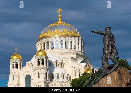 Kronstadt, Saint Petersburg, Russia — June 24, 2020: Fragment of Monument to Russian vice-admiral Stepan Makarov and Saint Nicholas Naval Cathedral Stock Photo