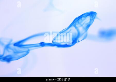 Ink Drop Mystic Magic Dynamic Motion in Water. Soft Background. Stock Photo