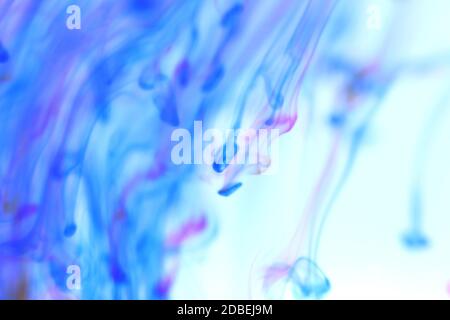Falling Colored Ink Mystic Dynamic Motion in Water. Ambient Soft Background. Stock Photo