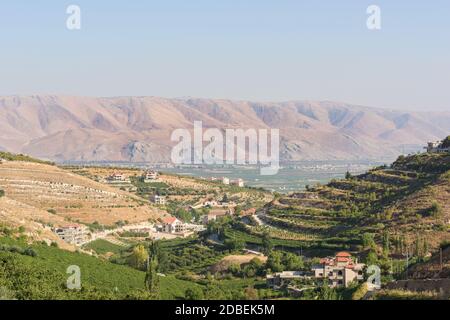 Panorama of the Bekaa Valley landscape over Fourzol, with ancient Roman temple of Niha and Anti-Lebanon mountains, in Zahle, Lebanon Stock Photo