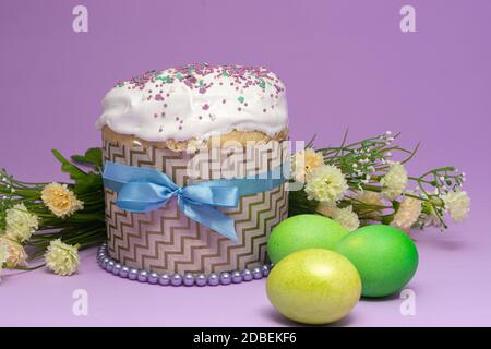 beautifully decorated Easter cake with yellow-green eggs and flowers Stock Photo