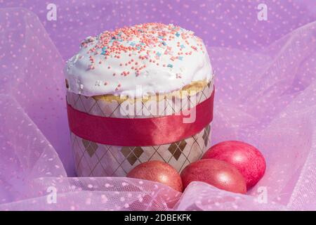 Easter cake decorated with pink decor and rose-colored eggs Stock Photo