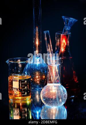 Chemical glassware with rack close-up on blue background Stock Photo