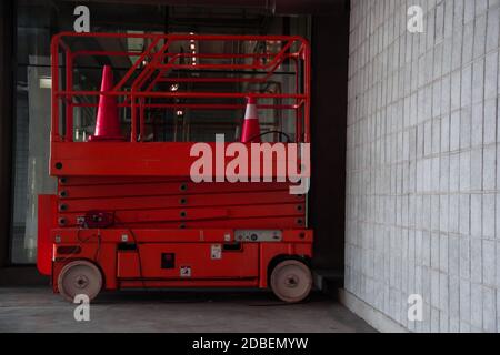 distribution warehouse hall with hydraulic scissors lift platform Stock Photo