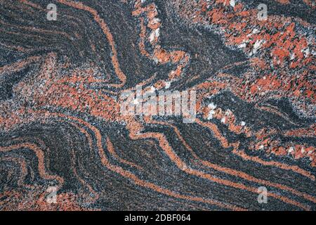 Abstract red pattern in a smooth stone slab Stock Photo