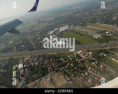 LOT Airlines B737-800 flight from London Heathrow to Warsaw,Poland approaches Chopin Airport,Warsaw as viewed from right hand passenger cabin window o Stock Photo