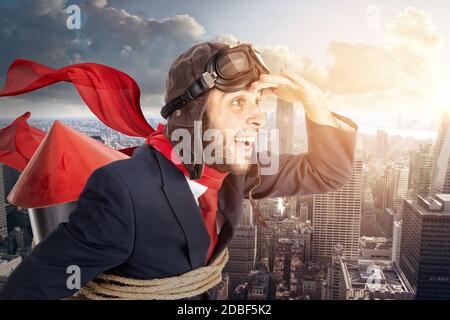 Businessman with homemade rocket and googles ready for a challenge Stock Photo