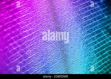 Macro shot of a reticulated, wavy pink-blue surface made up of small flashes Stock Photo