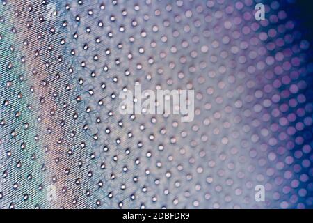 Macro shot of a pointy, wavy, colorful surface made up of small flashes Stock Photo