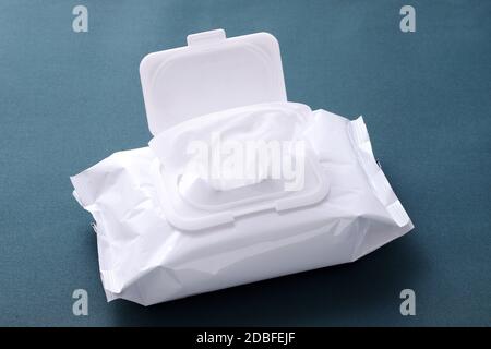 wet tissue paper package on wooden table Stock Photo