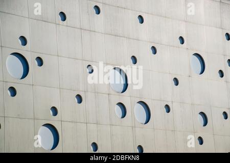 Background texture. A wall with round holes in the form of gas bubbles. Stock Photo