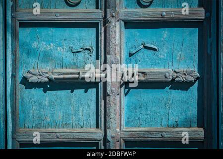 Latch with padlock on door in India Stock Photo